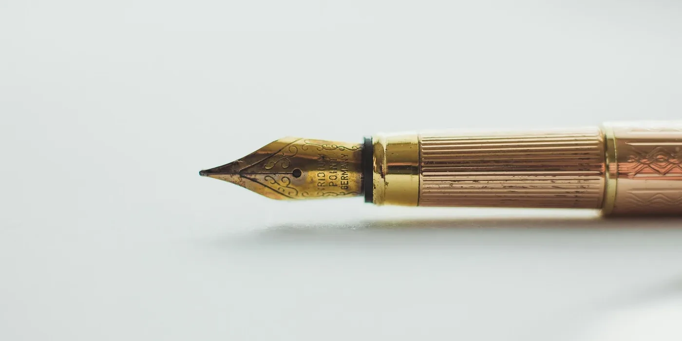 Writing pen (Photo by Art Lasovsky on Unsplash)
