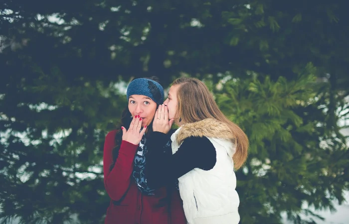 Two people gossiping