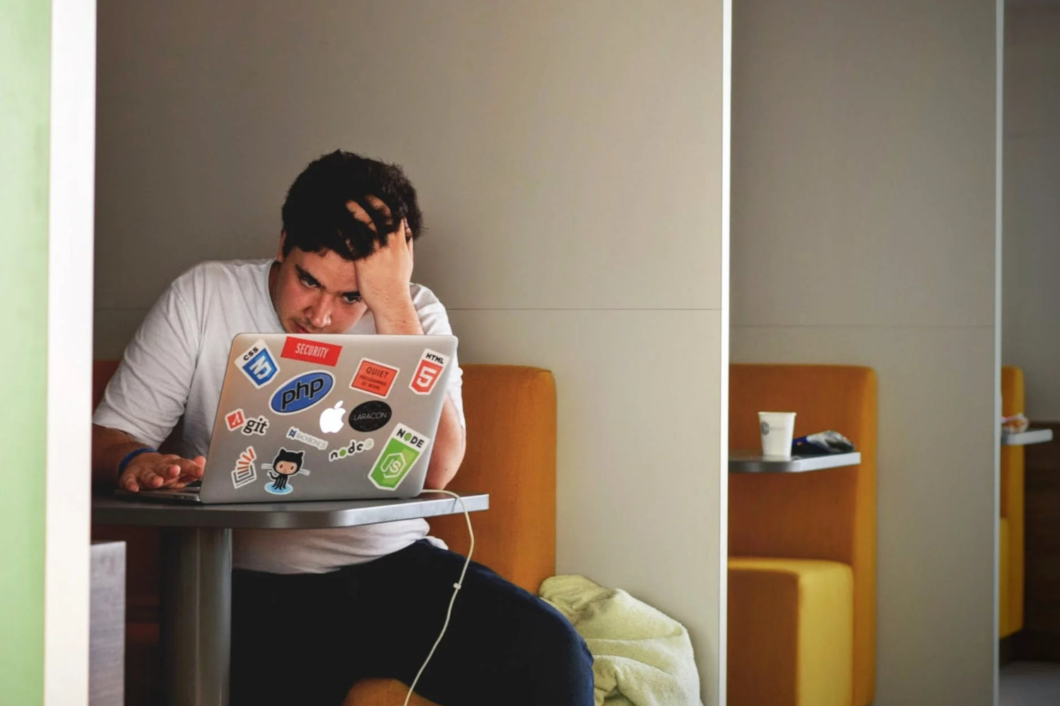 Man looks desperately at computer