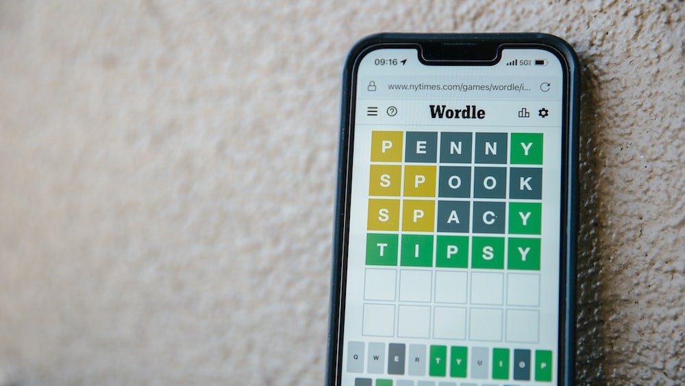 A phone with the game Wordle on